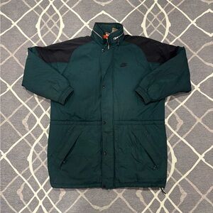 Vintage Nike puffer jacket in a rare dark forest green